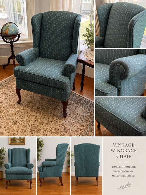 Vintage wingback chair in teal patterned fabric with tufted arms and wooden legs